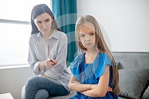 Mother and daughter ahving a conflict and looking stressed