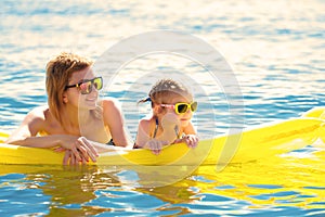 Mother and daughter on airbed