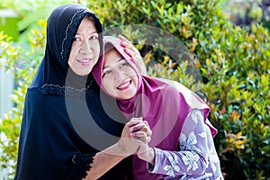 Mother and daughter from Asia forgive each other