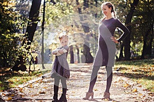 Mother with daughter in the autumn park