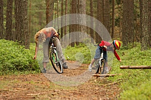Mother daughter on bicycles