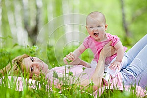 Mother and daughter in birch spring park
