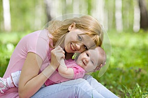 Mother and daughter in birch spring park