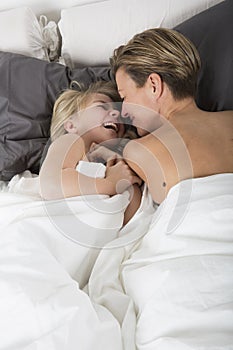 Mother and Daughter bonding in bed photo