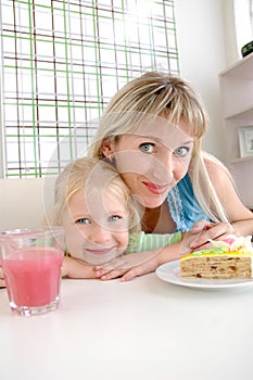 Mother with a daughter in cafe