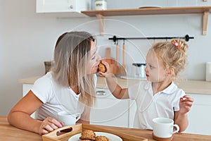 Mother and daughter Cooking in kitchen. Happiness Cooking Activity Concept