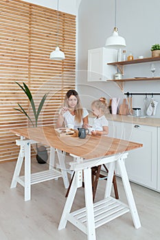 Mother and daughter Cooking in kitchen. Happiness Cooking Activity Concept