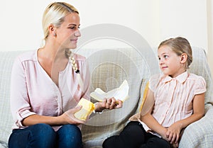 Mother with daughter discussing menstruation and sanitary products