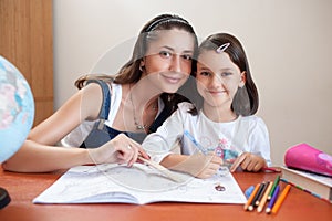 Mother and daughter do homework at home