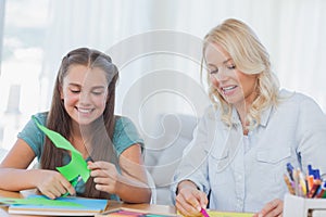 Mother and daughter doing arts and crafts together