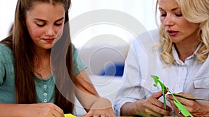 Mother and daughter doing arts and crafts together