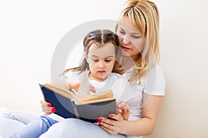 Mother and daughter doing homework at home