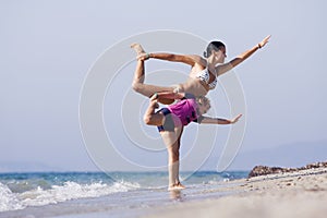 Mother and daughter doing joga