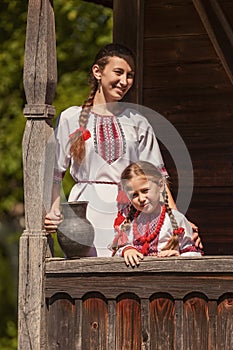 mother and daughter dressed in Ukrainian national costumes