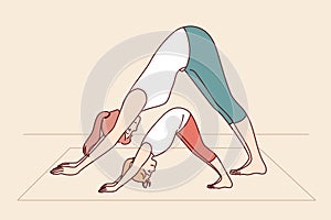 Mother and daughter are engaged in yoga and exercises, leading healthy lifestyle.