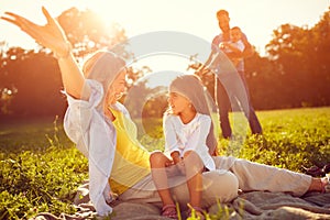 Mother with daughter enjoy on picnic