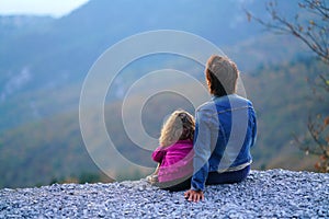 Mother and daughter enjoy the view of the enchanted nature of the mountain in Euboea