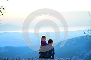 Mother and daughter enjoy the view of the enchanted nature of the mountain in Euboea