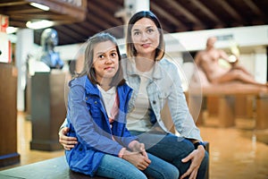 Mother and daughter enjoying expositions of previous centuries