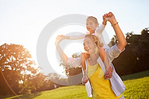 Mother with daughter enjoying in nature