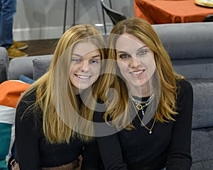 Mother and daughter enjoying posing for a picture at Thanksgiving dinner in Edmond, Oklahoma.