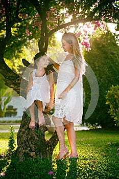 Mother and daughter in a fabulous garden