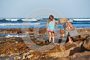 Mother daughter fishing beach