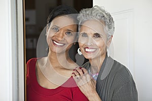 Mother and daughter at the front door photo