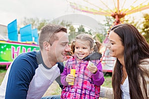 Mother and daughter at fun fair, chain swing ride