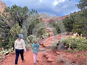 A mother and daughter going for a hike on a winter day in Sedona, Arizona, USA