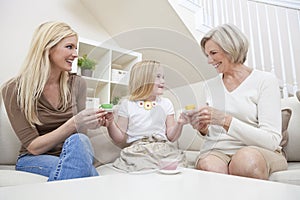 Mother, Daughter, Grandmother Family Drinking Tea