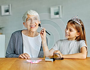 mother daughter grandmother granddaughter beauty makeup cosmetic face fashion make-up beautiful care glamour applying