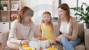 Mother, daughter and grandmother having tea party