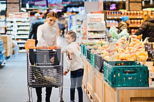 Mother with daughter at a grocery store