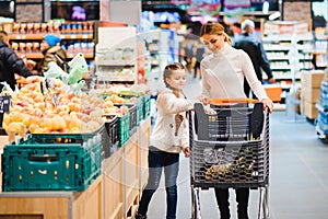 Mother with daughter at a grocery store