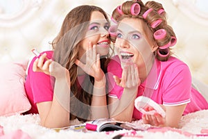 Mother and daughter in hair curlers