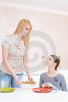 Mother and daughter have lunch