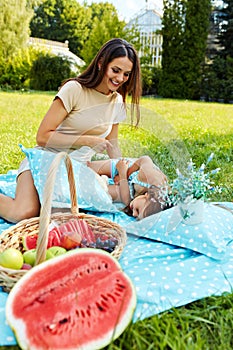 Mother And Daughter Having Fun In Park. Family Playing Outdoors