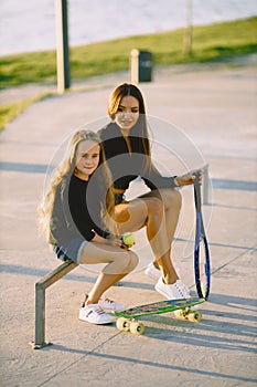 Mother and daughter having fun while skating at park