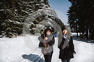 Mother and daughter having fun in the snow