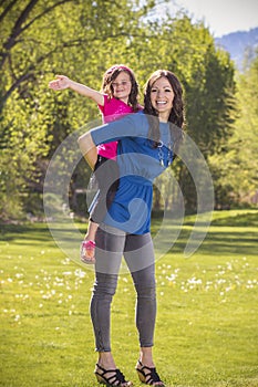 Mother and daughter having fun together outdoors