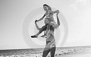 Mother and daughter having fun on tropical beach - Mum playing with her kid in holiday vacation - Family lifestyle and love