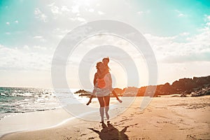 Mother and daughter having fun on tropical beach - Mum playing with her kid in holiday vacation - Family lifestyle and love