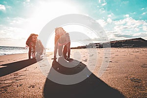 Mother and daughter having fun on tropical beach - Mum playing with her kid in holiday vacation - Travel, family lifestyle and