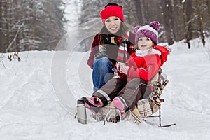 Mother and daughter having fun at winter time