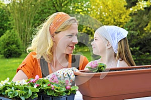 Mother and daughter having gardening time