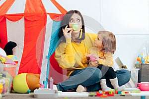 Mother and Daughter Having a Tea Party Role Play Game