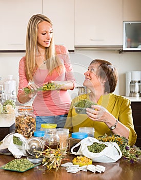 Mother and daughter with herbal tea