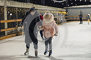 mother and daughter ice skating