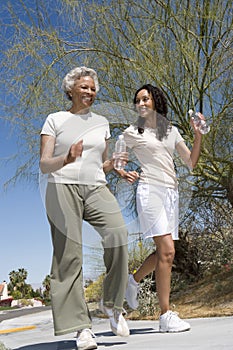 Mother And Daughter Jogging Together photo